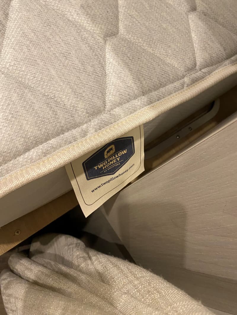 Two Pillow Honey label sewn onto a mattress
